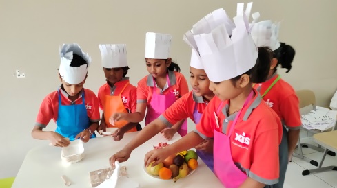 Children preparing fruits.