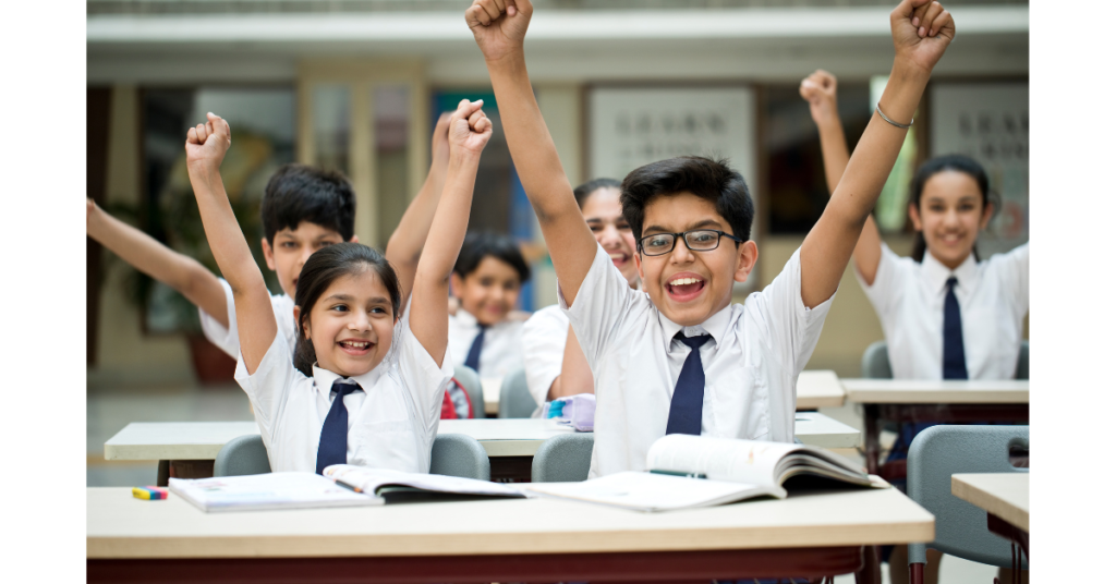 Image shows kids of XIS learning and in a joyful mood